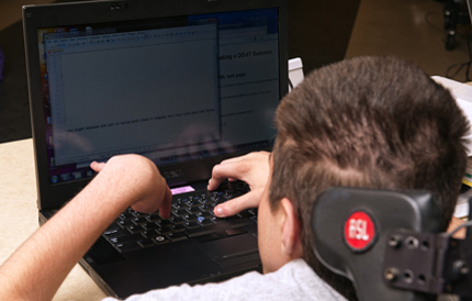 Person with disability using a laptop.