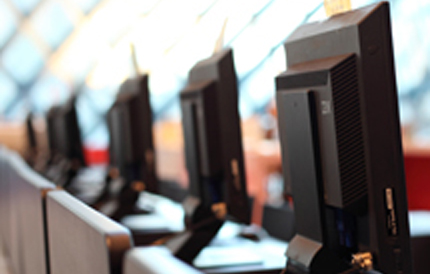 Photo of a row of computer monitors
