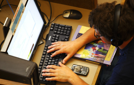 Photo of a person using a laptop