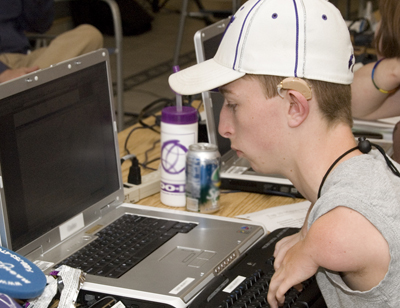 A student with a mobility impairment uses a computer