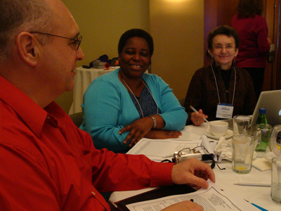 Three CBI participants discuss a topic